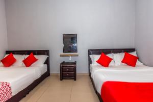 Postel nebo postele na pokoji v ubytování OYO 1185 Ho Hotel
