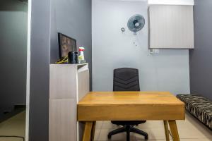 TV a/nebo společenská místnost v ubytování OYO 1185 Ho Hotel + 17 fotografií