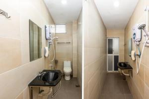 Koupelna v ubytování OYO 1185 Ho Hotel