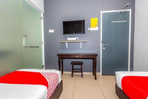 Postel nebo postele na pokoji v ubytování OYO 1185 Ho Hotel