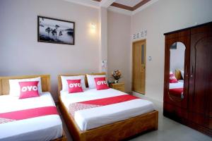 Postel nebo postele na pokoji v ubytování Thanh Thanh Nhan Hotel