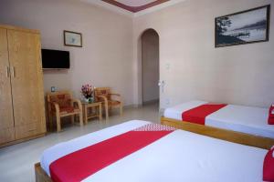 Postel nebo postele na pokoji v ubytování Thanh Thanh Nhan Hotel