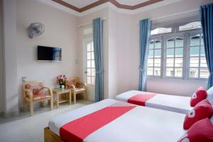 Postel nebo postele na pokoji v ubytování Thanh Thanh Nhan Hotel