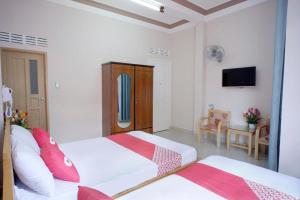 Postel nebo postele na pokoji v ubytování Thanh Thanh Nhan Hotel