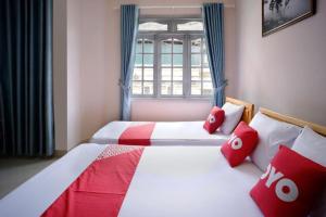 Postel nebo postele na pokoji v ubytování Thanh Thanh Nhan Hotel