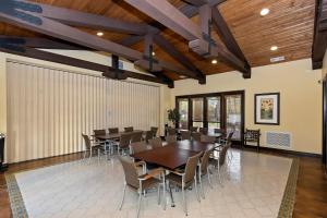 a dining room with a table and chairs at Spanish Walk Villa - PD condo near acrisure in Palm Desert