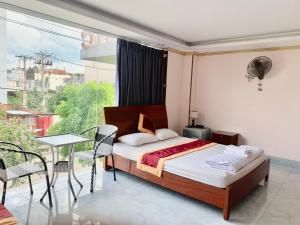 Postel nebo postele na pokoji v ubytování Nhan Duc Hotel