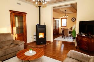 a living room with a couch and a fireplace at Villa Mia in Kotor