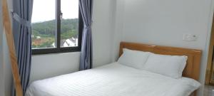 Katil atau katil-katil dalam bilik di Ngoc Anh Hotel Da Lat