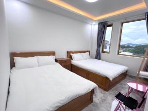 Katil atau katil-katil dalam bilik di Ngoc Anh Hotel Da Lat