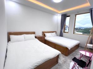Katil atau katil-katil dalam bilik di Ngoc Anh Hotel Da Lat
