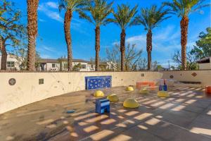 a skate park with palm trees in the background at Spanish Walk Villa - PD condo near acrisure in Palm Desert