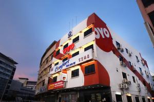 a building with a sign on the side of it at Super OYO 473 Comfort Hotel 2 in Klang