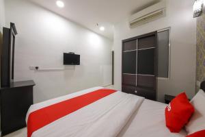 Postel nebo postele na pokoji v ubytování OYO 89497 Dream Nur Hotel