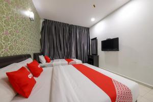 TV a/nebo společenská místnost v ubytování OYO 89497 Dream Nur Hotel