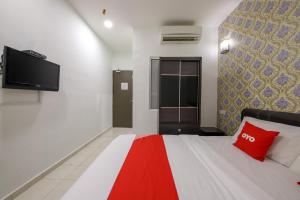 Postel nebo postele na pokoji v ubytování OYO 89497 Dream Nur Hotel