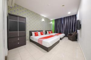 Postel nebo postele na pokoji v ubytování OYO 89497 Dream Nur Hotel
