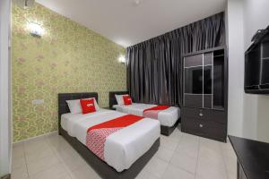 Postel nebo postele na pokoji v ubytování OYO 89497 Dream Nur Hotel