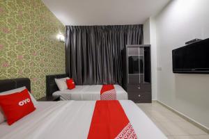 Postel nebo postele na pokoji v ubytování OYO 89497 Dream Nur Hotel