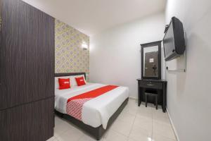 Postel nebo postele na pokoji v ubytování OYO 89497 Dream Nur Hotel