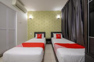 Postel nebo postele na pokoji v ubytování OYO 89497 Dream Nur Hotel