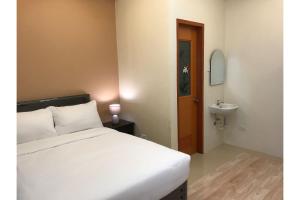 Postel nebo postele na pokoji v ubytování Guest Hotel