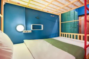 Postel nebo postele na pokoji v ubytování OYO 1074 Fin Hostel