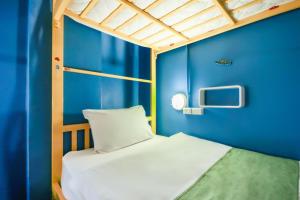 Postel nebo postele na pokoji v ubytování OYO 1074 Fin Hostel
