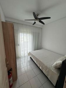 Postel nebo postele na pokoji v ubytování Takis Apartment + 13 fotografií