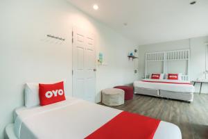 Postel nebo postele na pokoji v ubytování OYO 1074 Fin Hostel