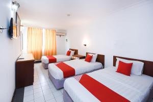 Postel nebo postele na pokoji v ubytování Super OYO 1018 Telang Usan Hotel Miri
