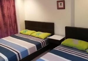 Postel nebo postele na pokoji v ubytování OYO 90842 Hotel Prai Jaya