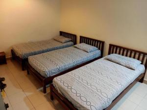 Postel nebo postele na pokoji v ubytování OYO 90842 Hotel Prai Jaya