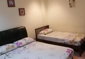 Postel nebo postele na pokoji v ubytování OYO 90842 Hotel Prai Jaya