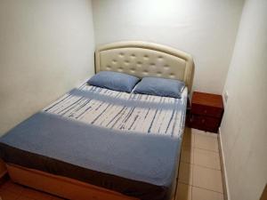 Postel nebo postele na pokoji v ubytování OYO 90842 Hotel Prai Jaya