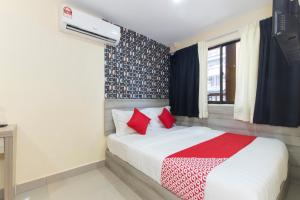 Postel nebo postele na pokoji v ubytování OYO 552 Hotel Kl Centre Point + 37 fotografií