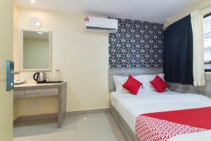 Postel nebo postele na pokoji v ubytování OYO 552 Hotel Kl Centre Point