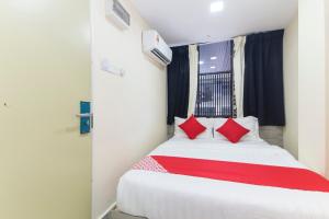 Postel nebo postele na pokoji v ubytování OYO 552 Hotel Kl Centre Point
