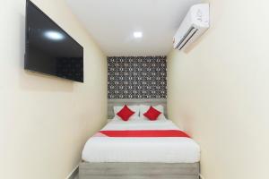 Postel nebo postele na pokoji v ubytování OYO 552 Hotel Kl Centre Point