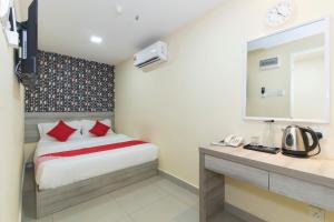 Postel nebo postele na pokoji v ubytování OYO 552 Hotel Kl Centre Point