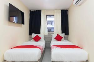 Postel nebo postele na pokoji v ubytování OYO 552 Hotel Kl Centre Point