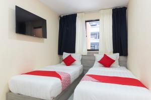 Postel nebo postele na pokoji v ubytování OYO 552 Hotel Kl Centre Point