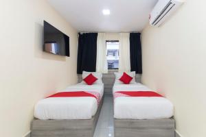 Postel nebo postele na pokoji v ubytování OYO 552 Hotel Kl Centre Point