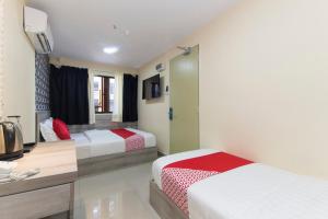 Postel nebo postele na pokoji v ubytování OYO 552 Hotel Kl Centre Point