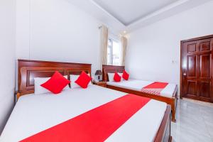Postel nebo postele na pokoji v ubytování OYO 446 The Bao Hotel