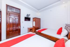 Postel nebo postele na pokoji v ubytování OYO 446 The Bao Hotel