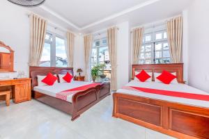 Postel nebo postele na pokoji v ubytování OYO 446 The Bao Hotel