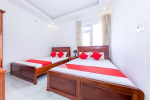 Postel nebo postele na pokoji v ubytování OYO 446 The Bao Hotel