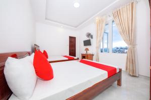 Postel nebo postele na pokoji v ubytování OYO 446 The Bao Hotel
