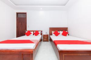 Postel nebo postele na pokoji v ubytování OYO 446 The Bao Hotel